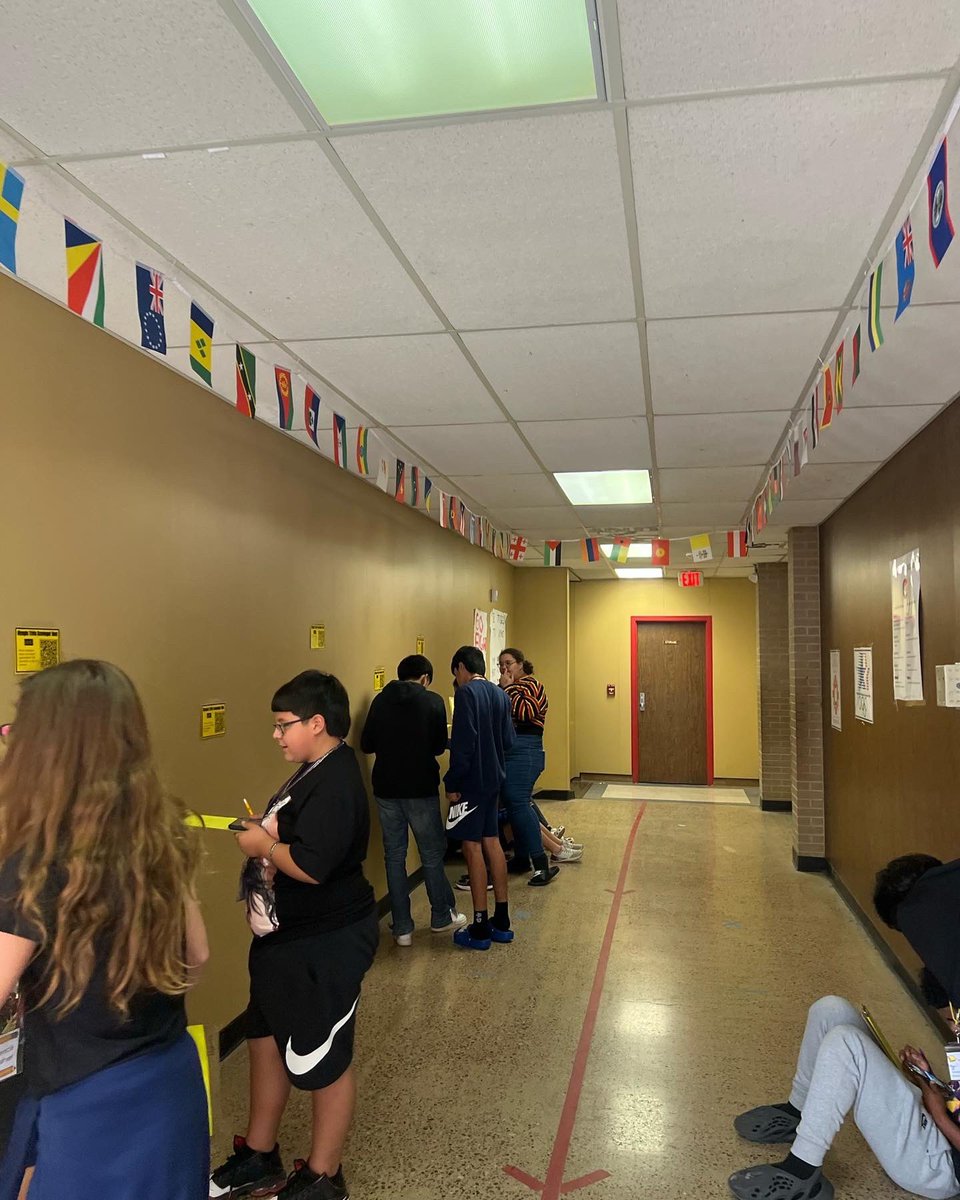 NorriScience's tweet photo. We started #physics by diving into our #olympics #internship. Students completed a QR scavenger hunt to learn Olympic trivia and got to explore the Olympic Village (our classroom/hallway). Some students could name over 50 country flags!  @lcvalenzuela #teachbetter #teachfurther https://t.co/uy57bgFanm
