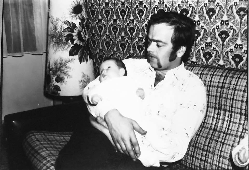 lilybee731's tweet image. My dad and I, sometime around 1973-1974. Look at that glorious handlebar moustache! Can’t remember any of the furnishings, but it’s a miracle it didn’t turn us all blind! 😵‍💫 #seventies #notsosubtle