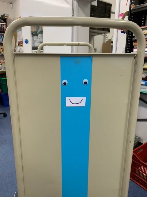 The January Challenge by 64 Million artists
5. Hello
'Add a face to an everyday object'
We have added a face to one of our shelving trolleys, what should their name be?
#TheJanuaryChallenge