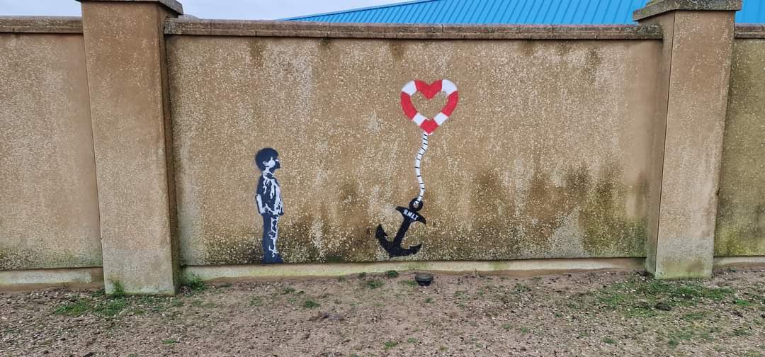 Beau775's tweet photo. @VicTheMac @Davvao have you see the Banksy type graffiti in Rhyl for the RNLI? I thought you’d like to see it or photograph it Vic if you haven’t seen it already 🥰 https://t.co/aYBm1MqlIs