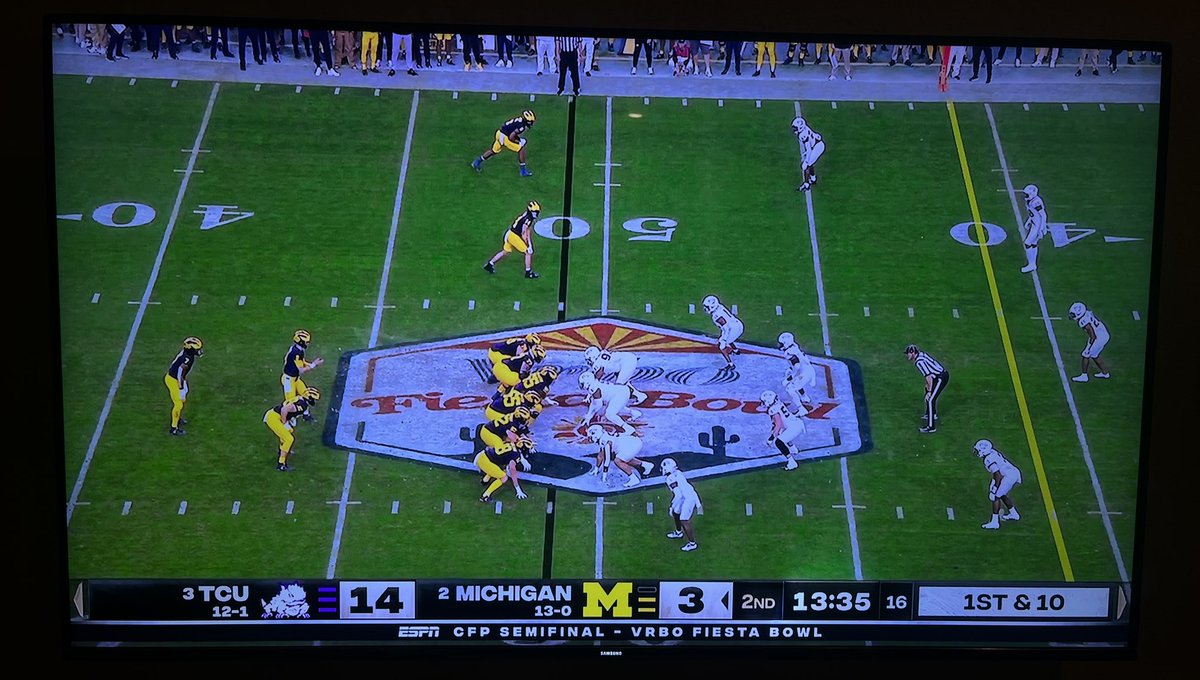 sbell021's tweet photo. Remember the Roman Wilson TD that got called back to the TCU 1 inch line?

The first screenshot is where Rod Moore intercepted the ball on the play before Michigan’s called-back TD pass.

The second one is where the officials had Michigan snap the ball on the called-back TD pass. https://t.co/fJiCb9YZnY