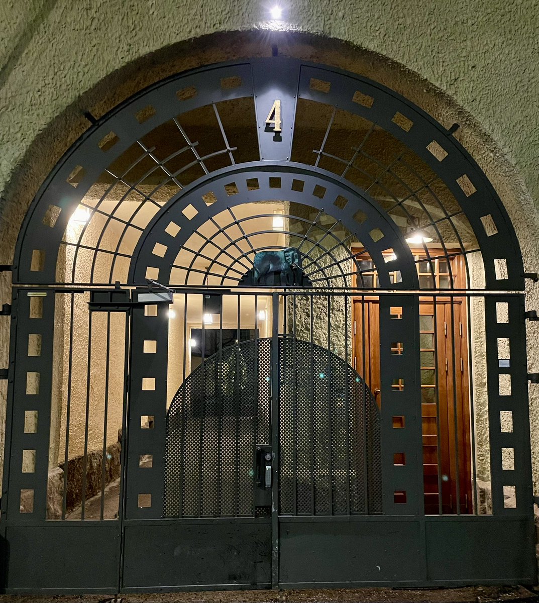 lasersilma's tweet photo. Walking through this gate was an absolute joy. There’s an elephant on top! And a Christmas tree in the courtyard! #doorwaysofhelsinki https://t.co/Bmtsnu9Ccx