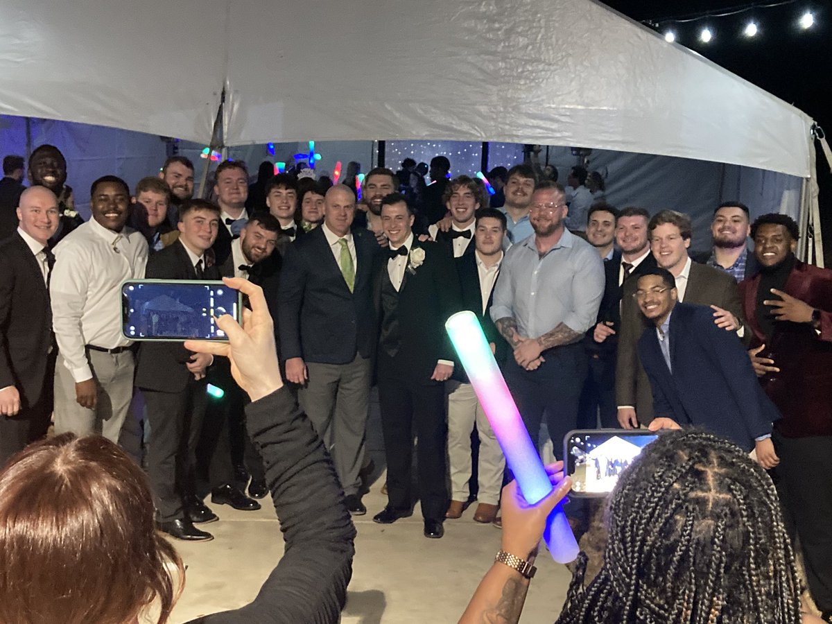 BlaineMcCorkle's tweet photo. No better way to spend NYE than w/ Mrs Gina on our anniversary while celebrating the captains wedding w/ the @BelhavenFB family. Congrats to Mr. Ben &amp; Mrs. Carly Owens!! #BUnited 
🔰⚔️🏈💍🙏🏻 https://t.co/qj25TCct0Y