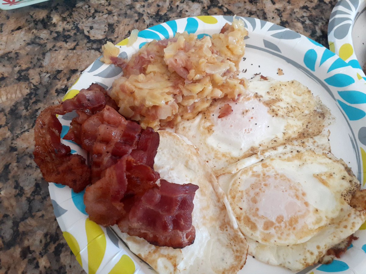 New Year's breakfast.  Over easy easy eggs , crisp bacon and my funky hashbrowns. Onion ham and cheese with plenty of butter. Time to detox now lol