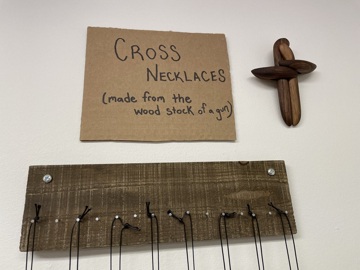 These crosses are made from the wood stock of guns!  You can get one now on our website: RAWToolsPhilly.org