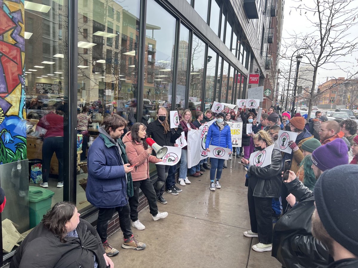 TraderJoesUnite's tweet photo. Yesterday in Minneapolis we closed out 2022 right with a walk out over unfair cuts to our hours! Union supporting crew members had shifts cut and given instead to dozens of recently hired staff. https://t.co/tNN0aJ1f1o