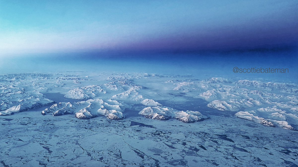 scottiebateman's tweet photo. The most amazing vistas over #Greenland today. As the sun dipped below the horizon the earths shadow was cast on the blue sky. A frozen ocean abutting mountains 14,000ft high. The scale is hard to see from 34,000ft. Reminds me of my school #geography lessons. #AvGeek   #WePilots https://t.co/K3egEy6ME1