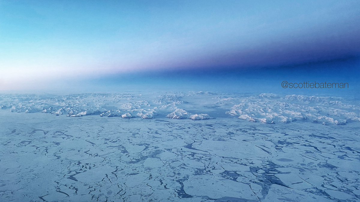 scottiebateman's tweet photo. The most amazing vistas over #Greenland today. As the sun dipped below the horizon the earths shadow was cast on the blue sky. A frozen ocean abutting mountains 14,000ft high. The scale is hard to see from 34,000ft. Reminds me of my school #geography lessons. #AvGeek   #WePilots https://t.co/K3egEy6ME1