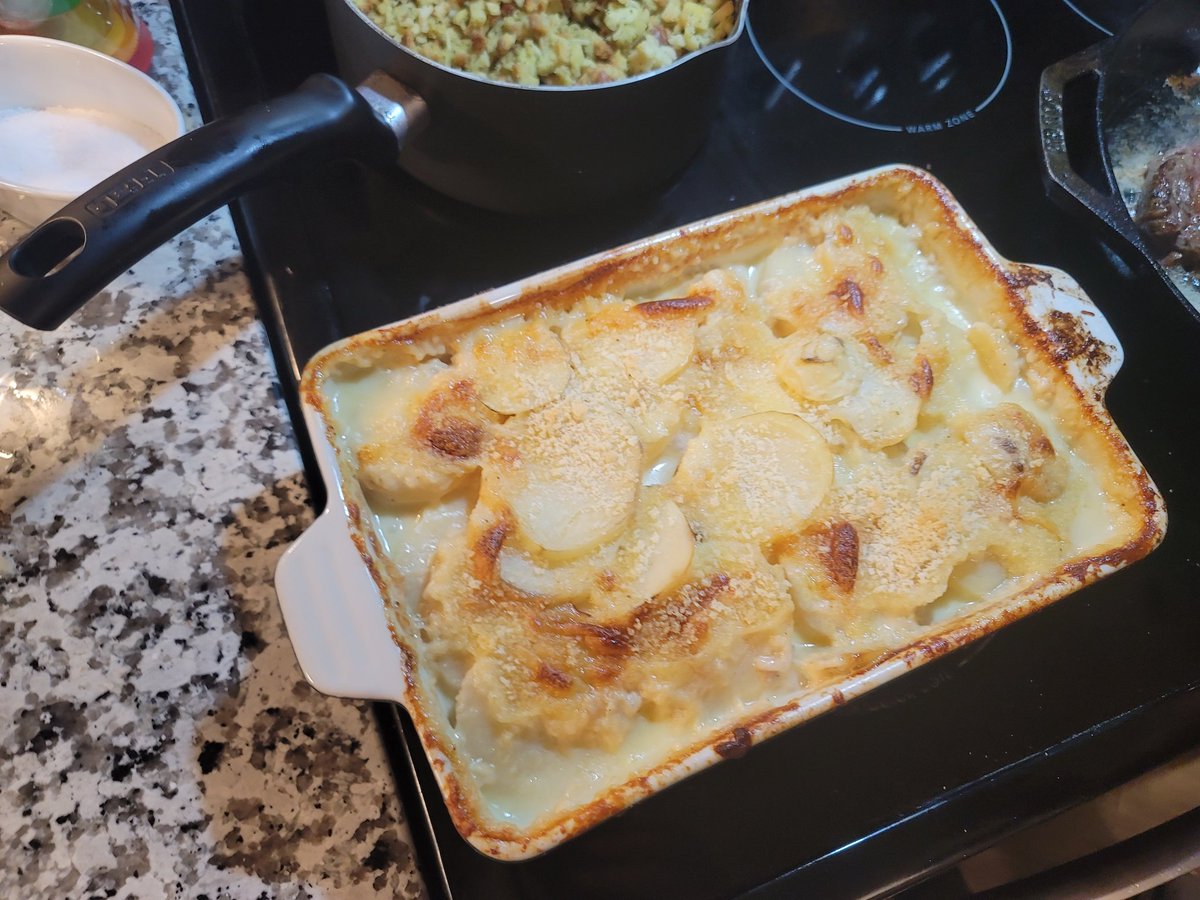 Kashydoggo's tweet photo. My boyfriend and I cooking a New Year's Day dinner~ 

The potatoes au gratin are my contribution.

#2023NewYear #Cooking #foodies #2023goals https://t.co/f8ogk1uXBR