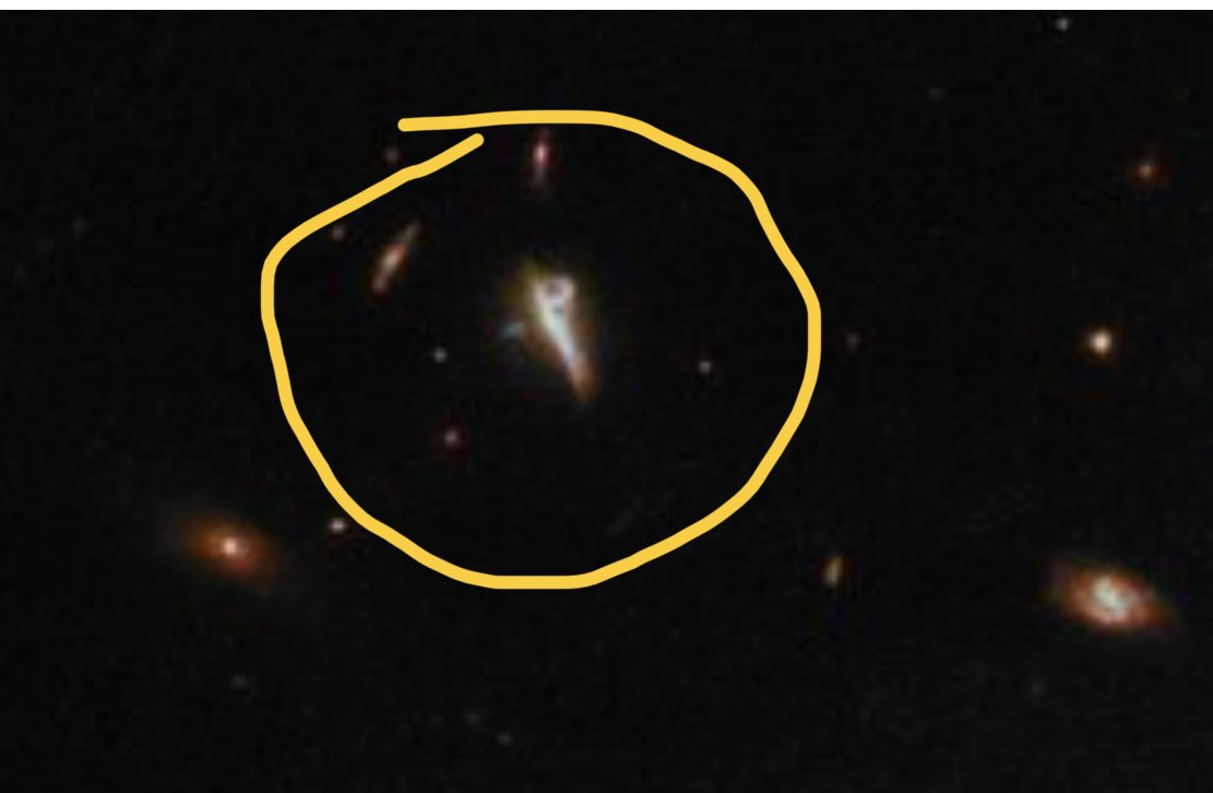 kamalsoor's tweet photo. Can somebody explain this odd structure in the background galaxy top left corner of image https://t.co/vwlmPkYi5Q