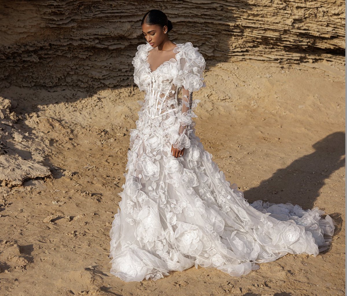 pninatornai's tweet photo. Bring the bridal drama with #MariagesCollection Style 4972! This gown is an A-line silhouette with organza flowers and leaves, a sheer boned bodice, and long sleeves with voluminous shoulders. Pearls and crystals adorn this fabulous gown for an extra touch of glamour! https://t.co/UWAw6imD3O