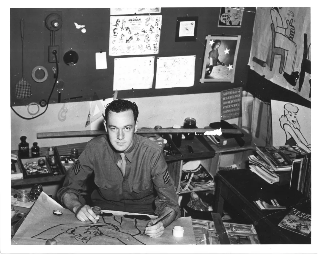 Stan Lee inking a cartoon while serving in the U.S. Army, 1943. Box 7, Stan Lee papers, American Heritage Center, University of Wyoming.