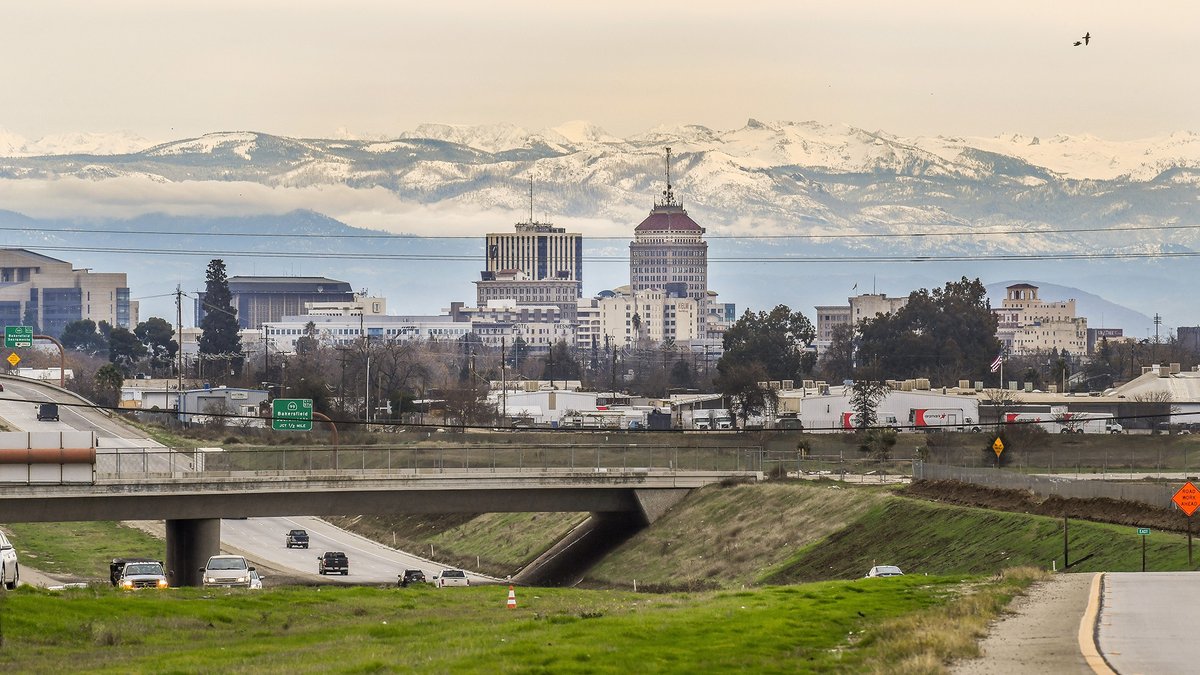 Snowy mountains visible from downtown fresno today after recent storms.
