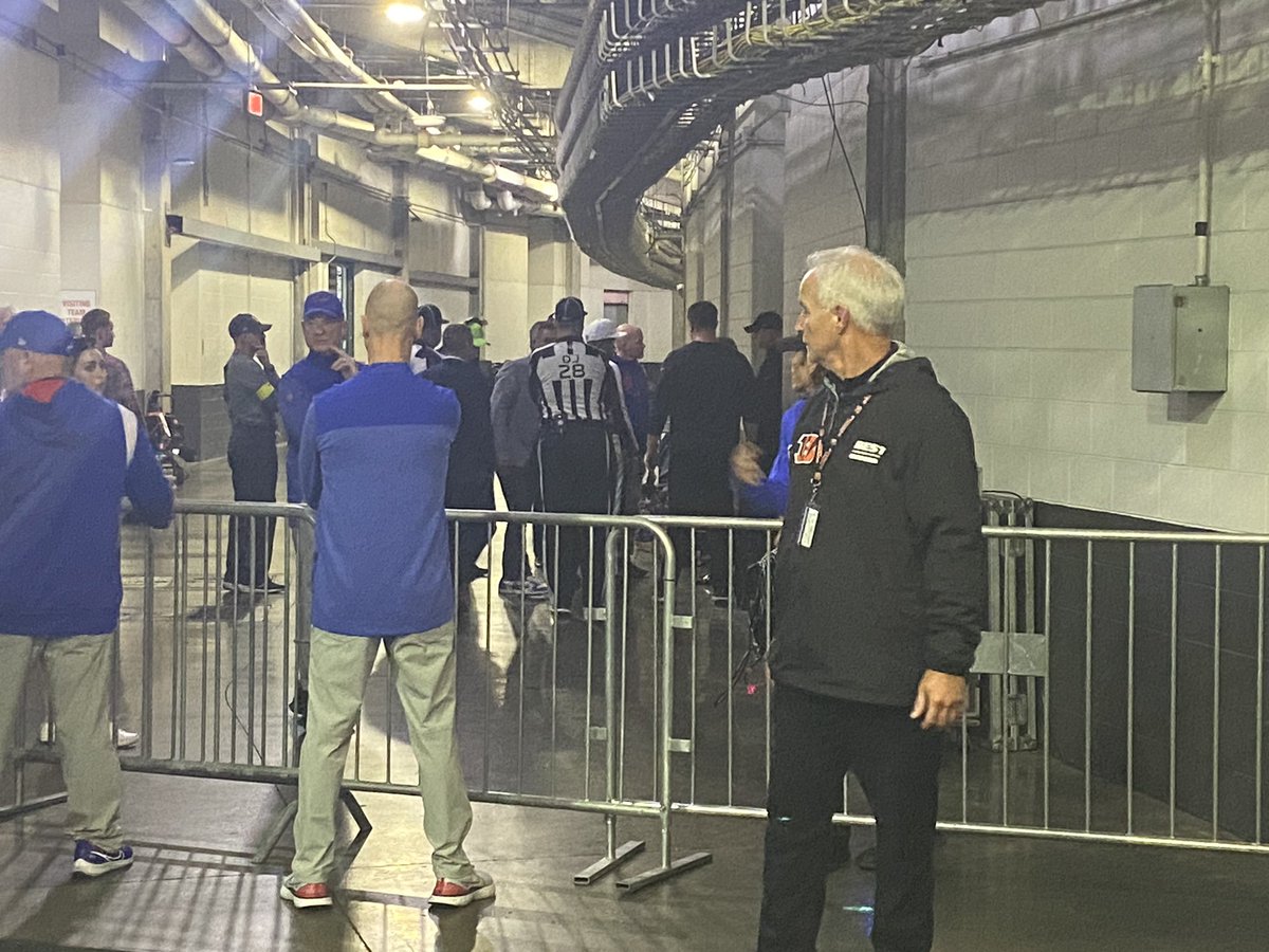 Referees, Bengals head coach Zac Taylor and Bills head coach Sean McDermott are meeting outside of the Bills locker room.