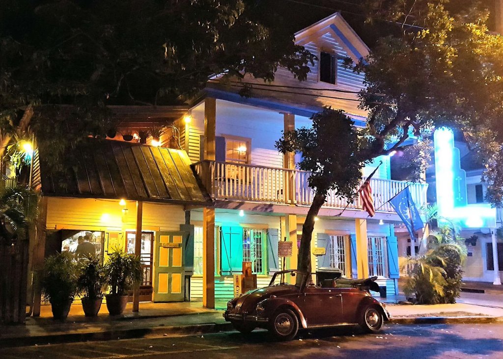 'Located in historic Bahama Village a hundred years ago this shuttered blue building sold spirits, hosted cockfights, gambling and Friday night boxing matches refereed by Ernest Hemingway.' Follow link for full view route1views.com/travel/blue-he…