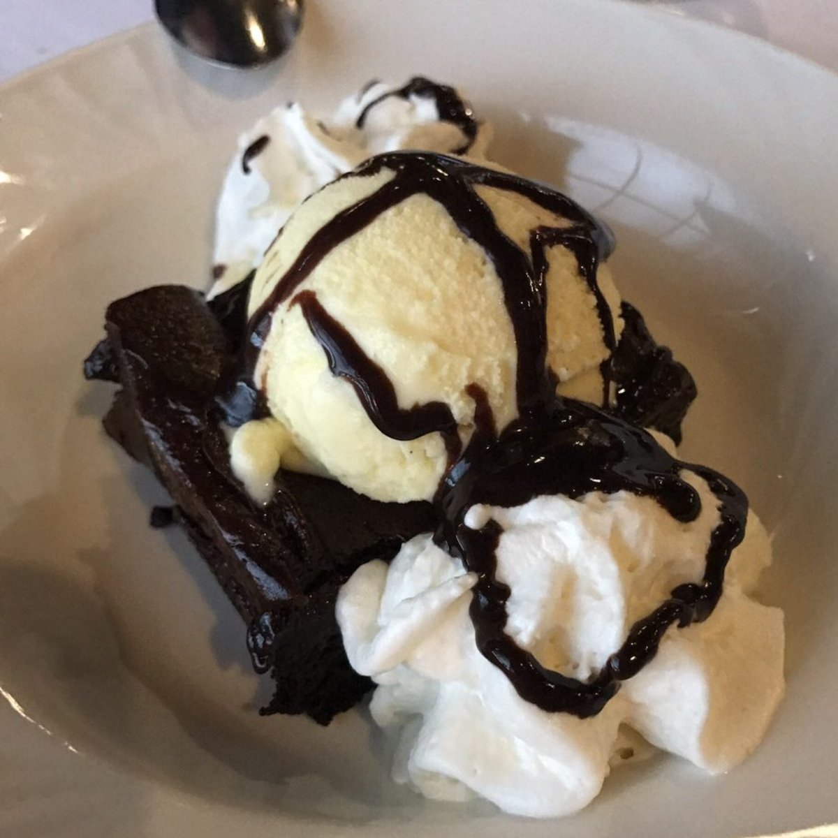 sandstonegrill's tweet photo. Have you tried our #ChocolateBrownie? It comes topped with vanilla ice cream, chocolate sauce, and whipped cream. https://t.co/fIndvwcYWu