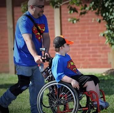 krazy1977's tweet photo. This will always be one my favorite pics of bubba &amp; I. It is roughly 7yrs old at the Special Olympics and was take by a professional. https://t.co/KWHg07X62W