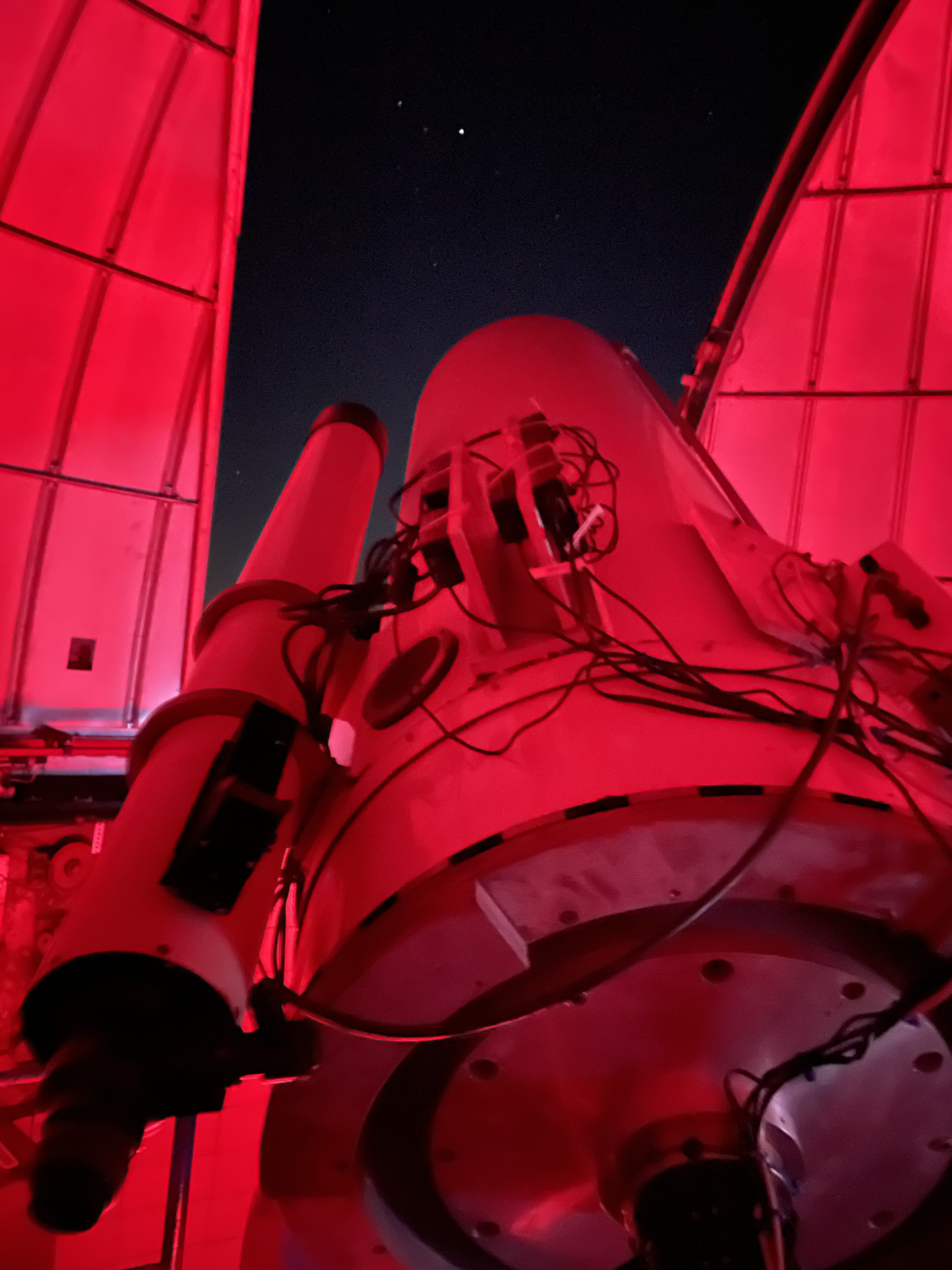 The 24" telescope at Yerkes Observatory looking at a bright Saturn seen through the opening in the dome. 