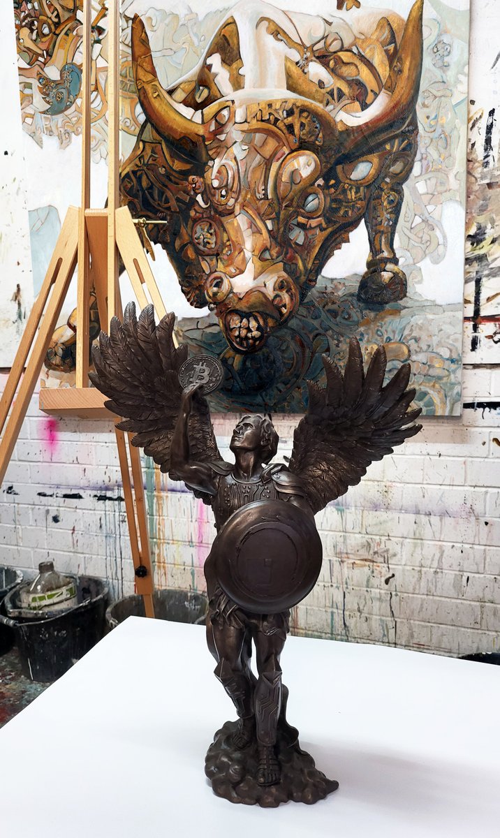 trevorjonesart's tweet photo. Happy birthday Bitcoin! My lucky number is 14 and today Bitcoin is 14 years old. 2023 is going to be a good year. 🔥

The Steampunk Bull watching over the Bitcoin Angel bronze sculpture in my studio. https://t.co/j5aTkNoVZC