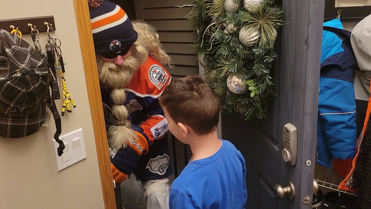 MertonWolf's tweet photo. It's a few days late, but got a visit from reg! Pretty solid dude hooked me and the kids up with crazy oilers swag for Christmas! https://t.co/ji8QpPKf0X