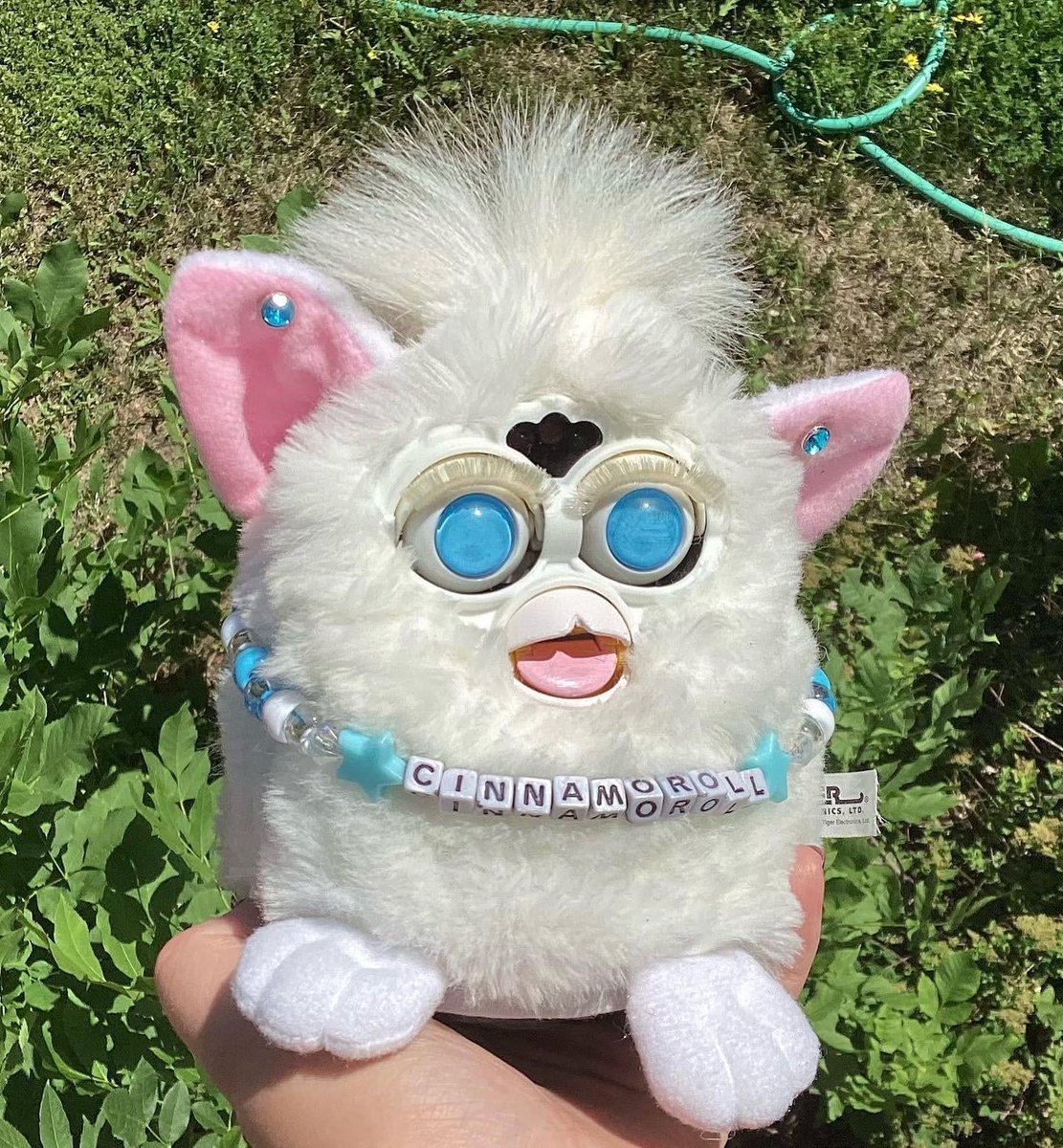 Otatron's tweet photo. @ironmouse Hey you follow the Furby scene way closer than I do; did you know about this custom Cinnamoroll Furby made by FurbyPuddle on Reddit? https://t.co/xpJr8NyjaN