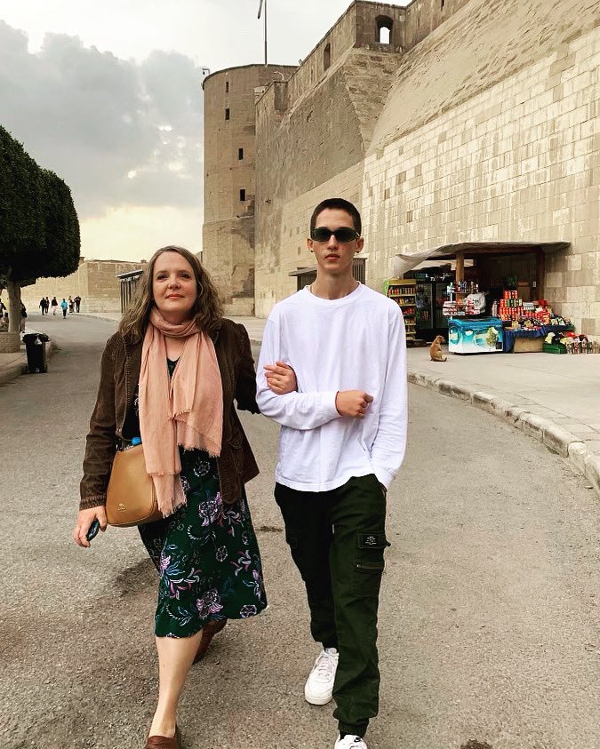 QuaveEthnobot's tweet photo. Early evening stroll in Cairo after visiting the Citadel and the Alabaster Mosque. Thankful for my son who is always there to lend an arm to help me walk when my amputated leg tires. 💕#disabilitymom #amputee #travelogue #Egypt https://t.co/MVXShz9r6I