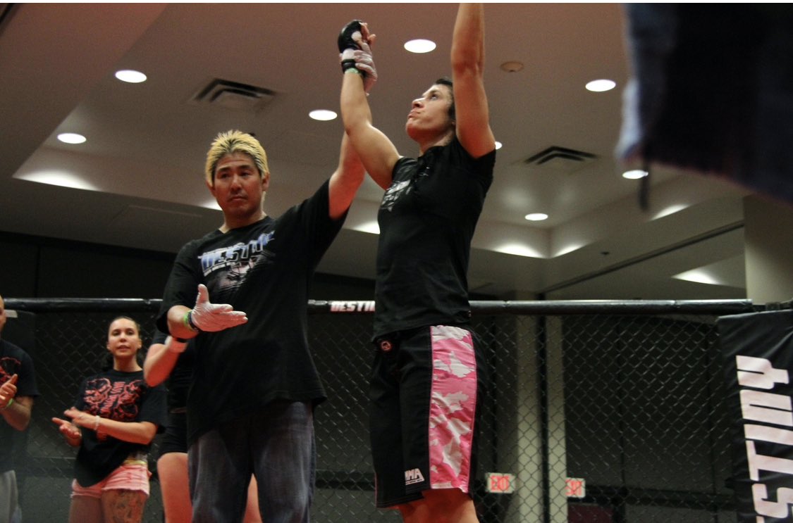 PinkRangerMMA's tweet photo. Keeping my head up going into 2023 because the good stuff comes from above…and chin down because that’s good technique.  

(Photo circa a while back) 

#happynewyear #mma #wmma #hawaiimma #waybackwednesday #honolulu https://t.co/5zeHgpZpRp