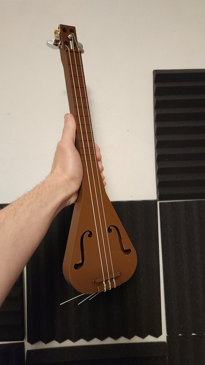grhmhomelinux's tweet photo. #3Dprinting #3string #guitar #ukulele I finished another 3 string instrument. This project still has no name. This may be my 50th or 51st instrument that I've 3d printed. I like the violin style f-holes. My favorite sound-hole design yet. https://t.co/Rchx9OfqzH