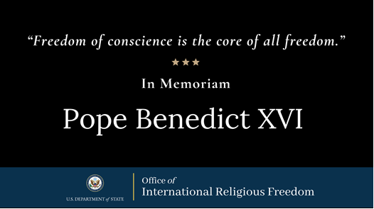 Memorial banner quoting Pope Benedict XVI, "Freedom of conscience is the core of all freedom."