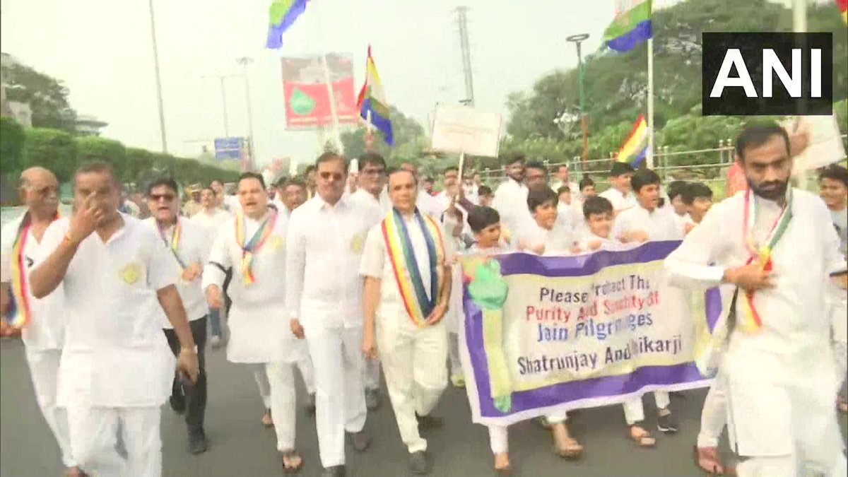 ANI's tweet photo. Andhra Pradesh | Members of the Jain community protest in Vijayawada against the decision of the Jharkhand govt to declare 'sacred' Shri Sammed Shikharji a tourist place https://t.co/KwEQKrE9Rq