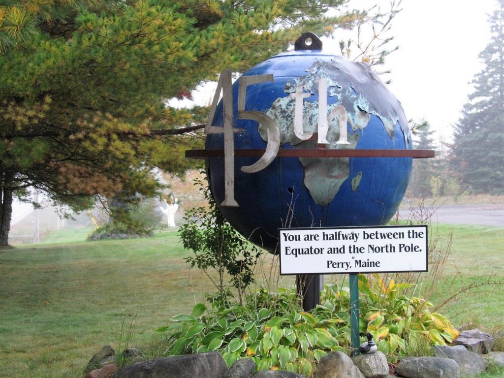 Located right on US Route 1 just north of Perry, Maine is a sweet little pull-off with a pink granite stone that marks the 45th parallel; exactly halfway between the equator and the North Pole. Follow link for full view route1views.com/travel/45th-pa…?