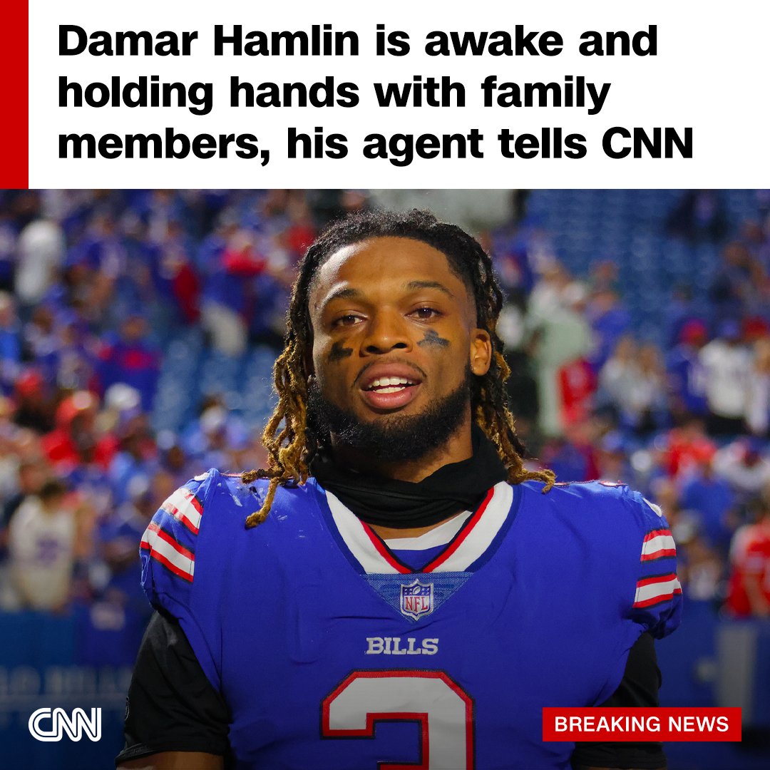 CNN's tweet image. Damar Hamlin’s agent says he is awake and has been holding hands with family in the hospital. cnn.it/3Cn0Csw