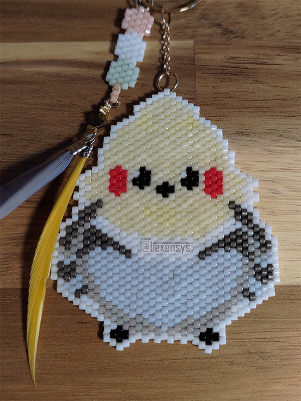 Olah everyone ! I wish you all a Happy New Year ! 
For the first work of the year.
A little golden finch and tricolor dango as Ei's companions as it's her banner time ! 
#Genshinlmpact #RaidenShogun #RaidenEi #Keychain
#crafts #beads #brickstitch