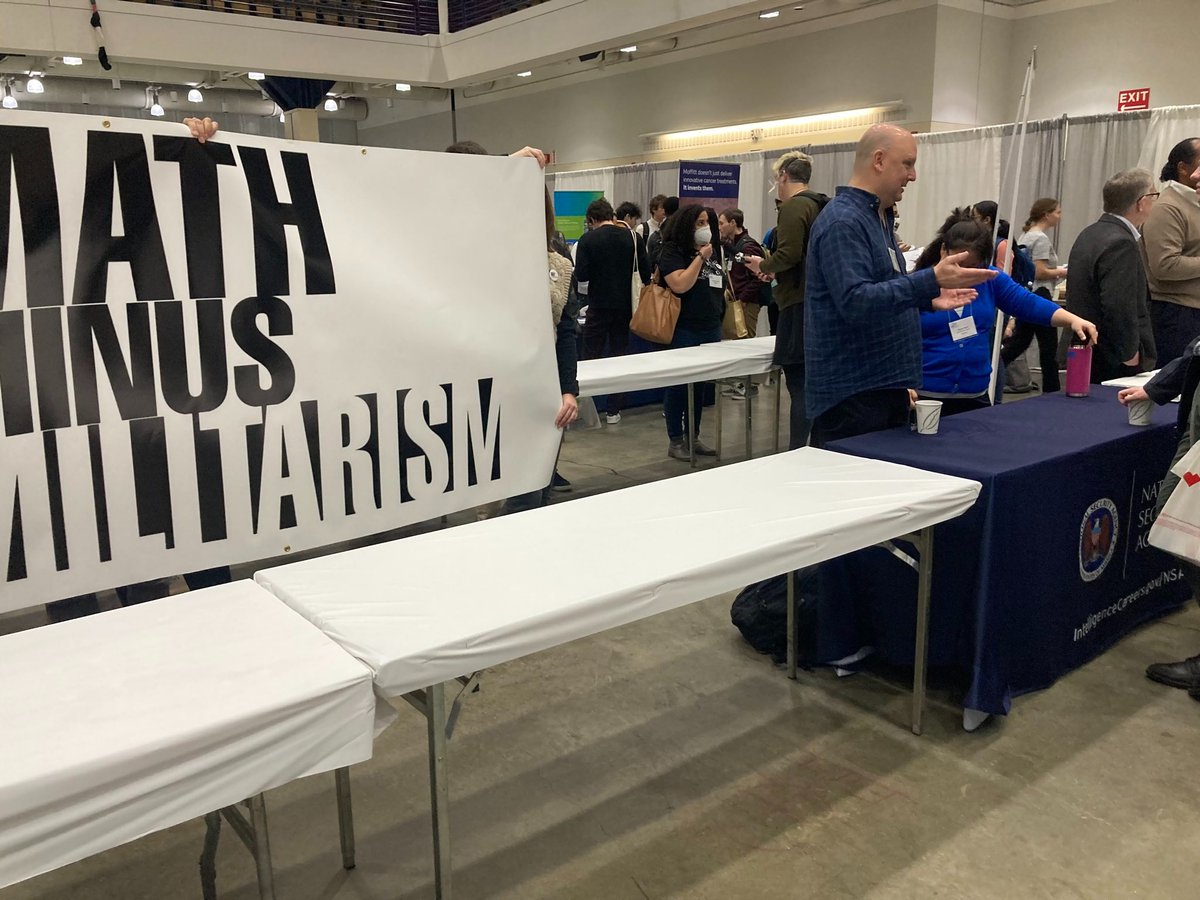 MuslimJustice's tweet photo. Today we joined @jm_collective at the American Mathematical Society’s annual Joint Mathematics Meeting and disrupted the NSA’s table at their career fair! We demand AMS stop providing the NSA space to recruit. https://t.co/3SUFkw3eoc /1 https://t.co/JkSdRWK2Mf
