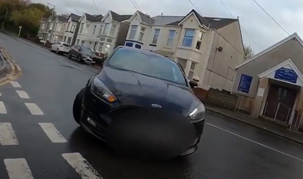 roadcc's tweet photo. NMotD 842: Passenger jumps out of car to remonstrate with cyclist… after driver cuts corner and almost hits him

“Get off the road, you’re going to cause an accident,” says our self-aware passenger – while standing in the middle of the road...
https://t.co/d6O5uA8LHh #cycling https://t.co/OUkcA5iCjl