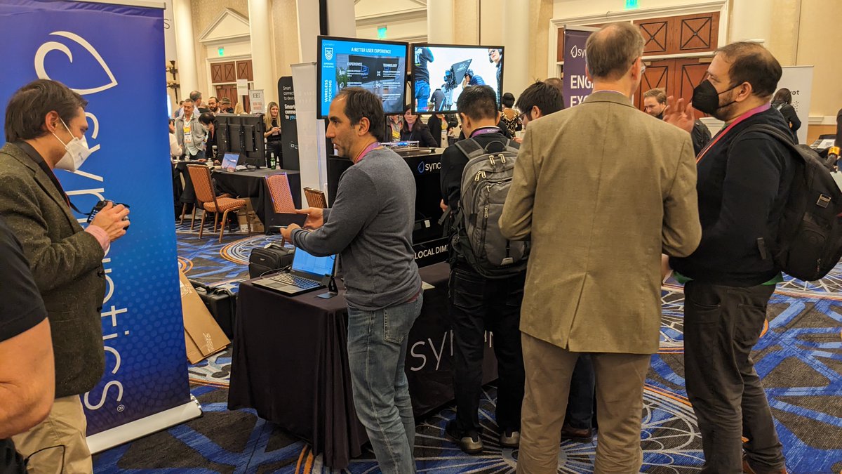 SynaCorp's tweet photo. A great night at #Pepcom showcasing some of our new innovations like #wirelessdocking for #PCs and multi-monitor setups, surface audio that transforms a display into an integrated speaker, and local dimming for enabling bright and power efficient #touchdisplays in cars #CES2023 https://t.co/NtKnzbEwce