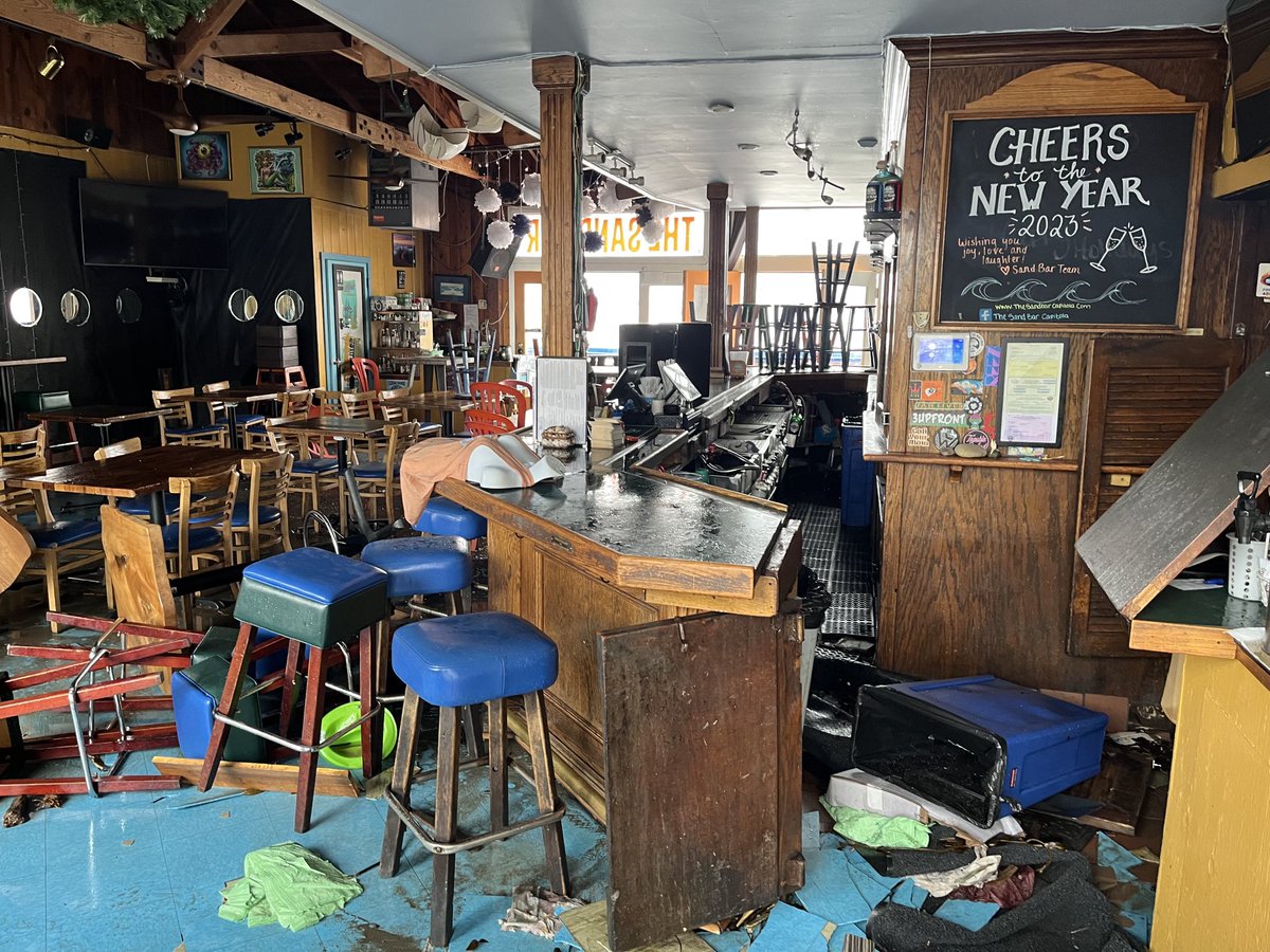Inside The Sand Bar in Capitola Village near Santa Cruz, and a debris-filled alley with a view of the broken wharf