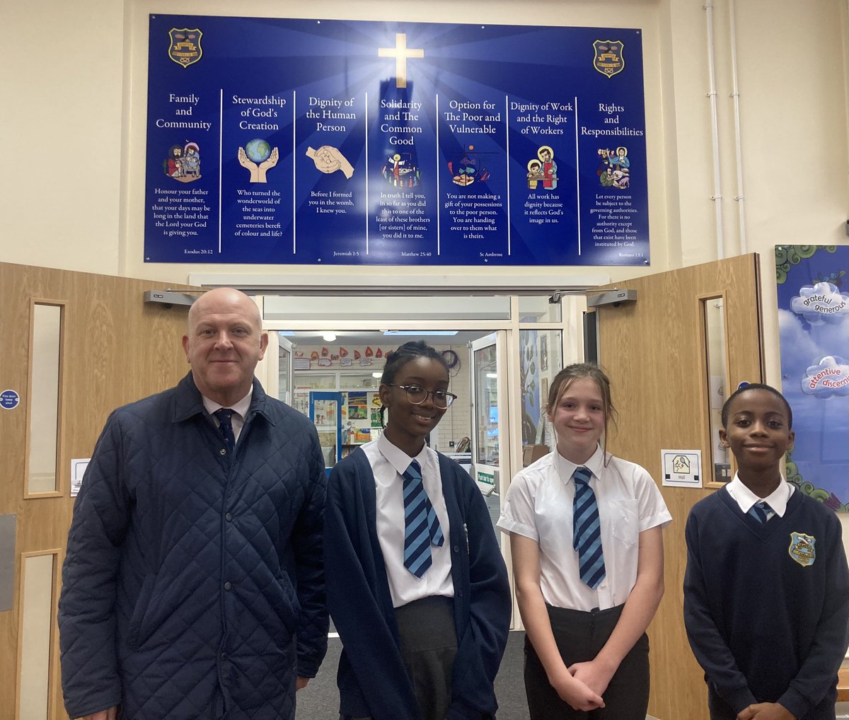 Our Faith Ambassadors were able to thank Steve Martin for the fabulous new signage @schoolsignscouk have fitted around @LittleStFrancis recently. They all look great including the #CatholicSocialTeaching display seen here. @BCPP__ @BhamDES @RCBirmingham #CatholicLife #ThankYou