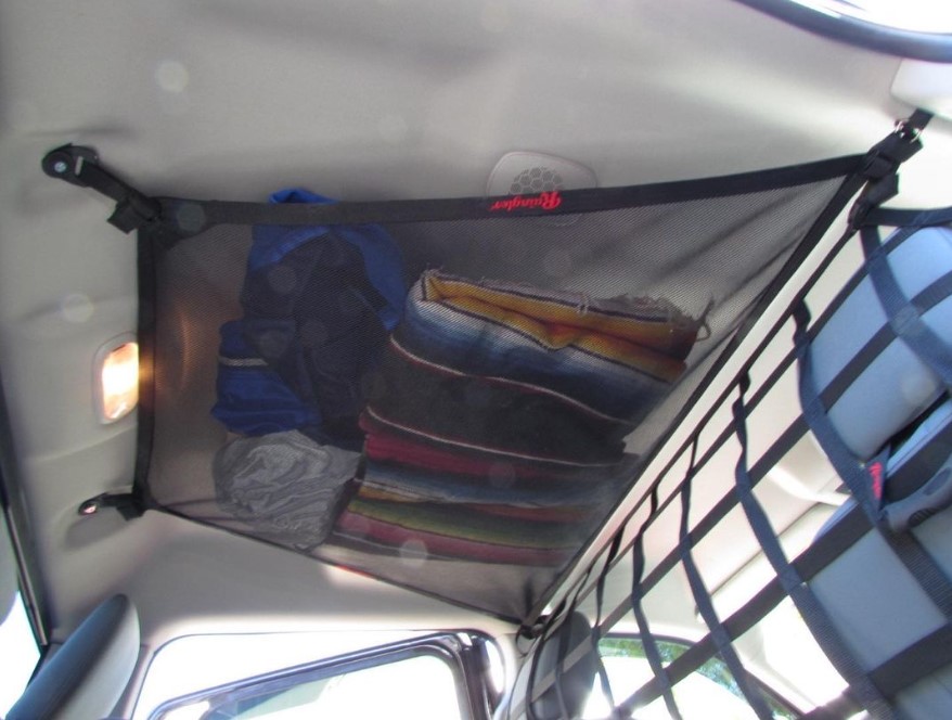 Need extra storage when traveling? Check out our ceiling attic storage nets. This one in 215psi MILSPEC mesh. Shown in #ramtruck available for most all trucks & SUV. #ram2500 #truckstuff  #offroadgear #vehiclestorage #extraspace  #overlandinggear raingler.com