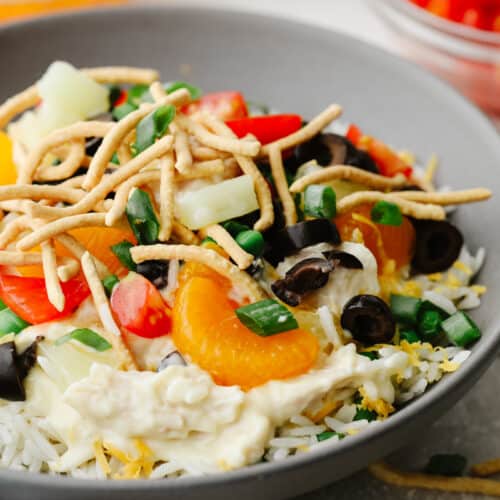 Hawaiian haystack (Idaho, Utah). Rice with chicken, crispy chow mein noodles, and pineapple. Often topped with coconut, veggies, and/or grated cheese