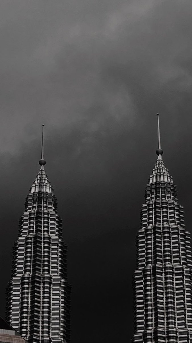 scrawnyaby's tweet photo. gloomy KLCC. https://t.co/75iLSADMCy