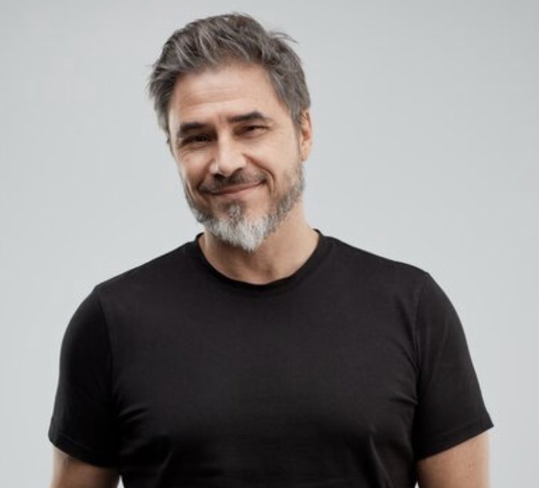 With the Announcement of Spring/Summer Concerts Coming to Chicagoland, Rob’s Plain Black T-Shirt Expected to Get Much Use; Rob, “Styx, Mellencamp? Heck yeah!” Son Braydon, “He’s afraid he’ll get made fun of at the show if he wears his usual Lululemon quarter-zip.”