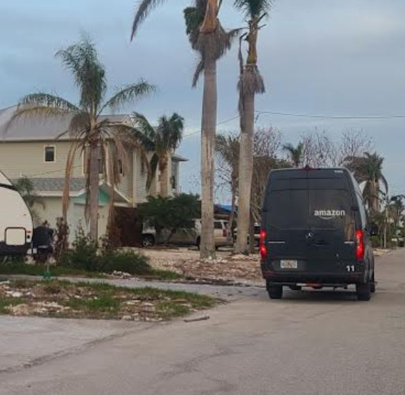 TalkBeach's tweet photo. Attention @senrickscott these are UPS and Amazon delivery trucks on Fort Myers Beach. An island @USPS still fears to roam...over 90 days after Ian. Residents cannot even mail a letter on FMB. You bragged about fixing this. Good work. https://t.co/LE8Lhkp3Qj