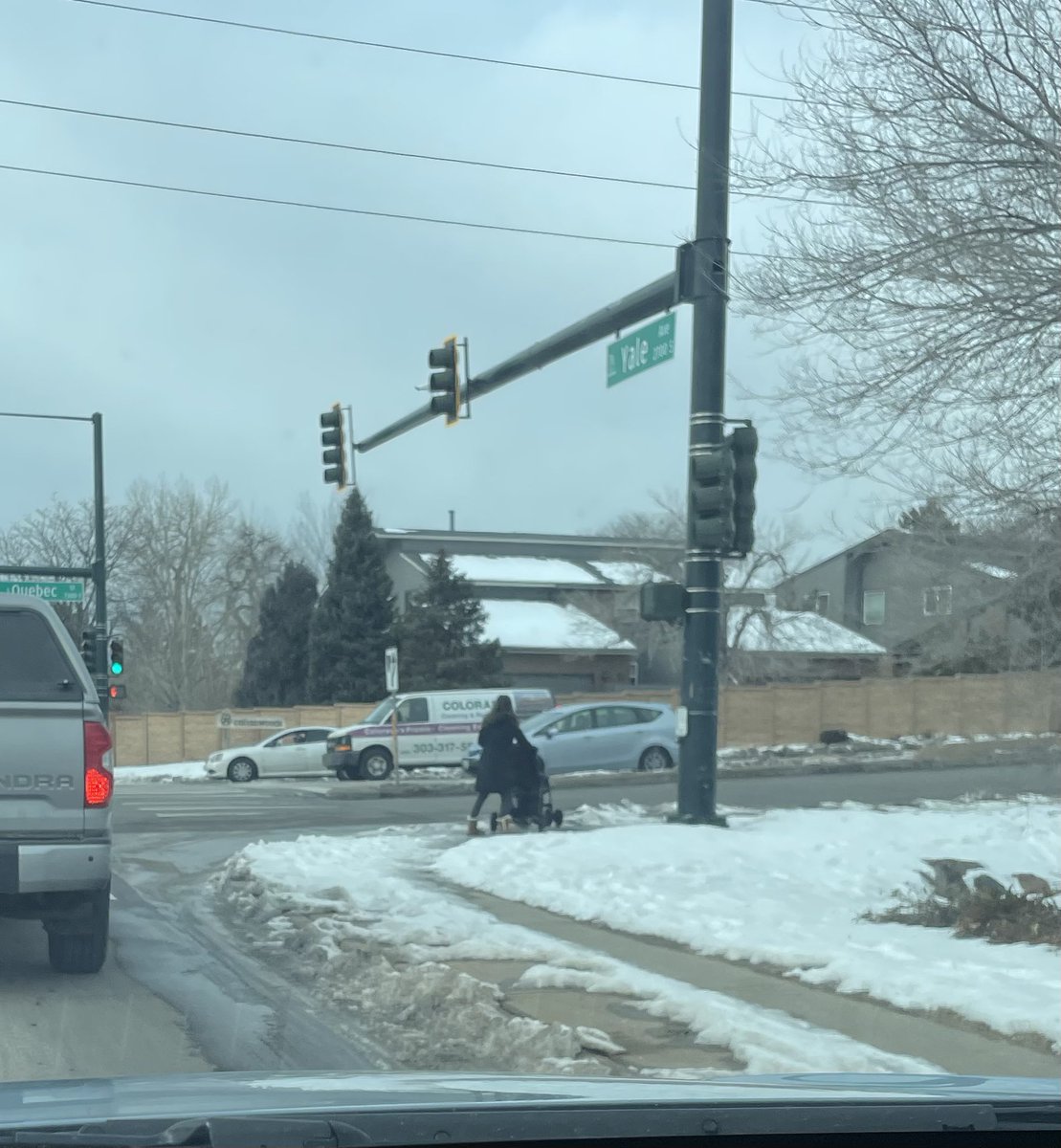 Hey <a href="/CityofDenver/">City and County of Denver</a>. I just passed a woman who had to walk a full block downhill in the turn lane with two kiddos in a stroller because the  sidewalk, including at the bus stop, is covered in ice and frozen chunks of plowed snow. And this is in the sun most of the day. Like, c’mon.