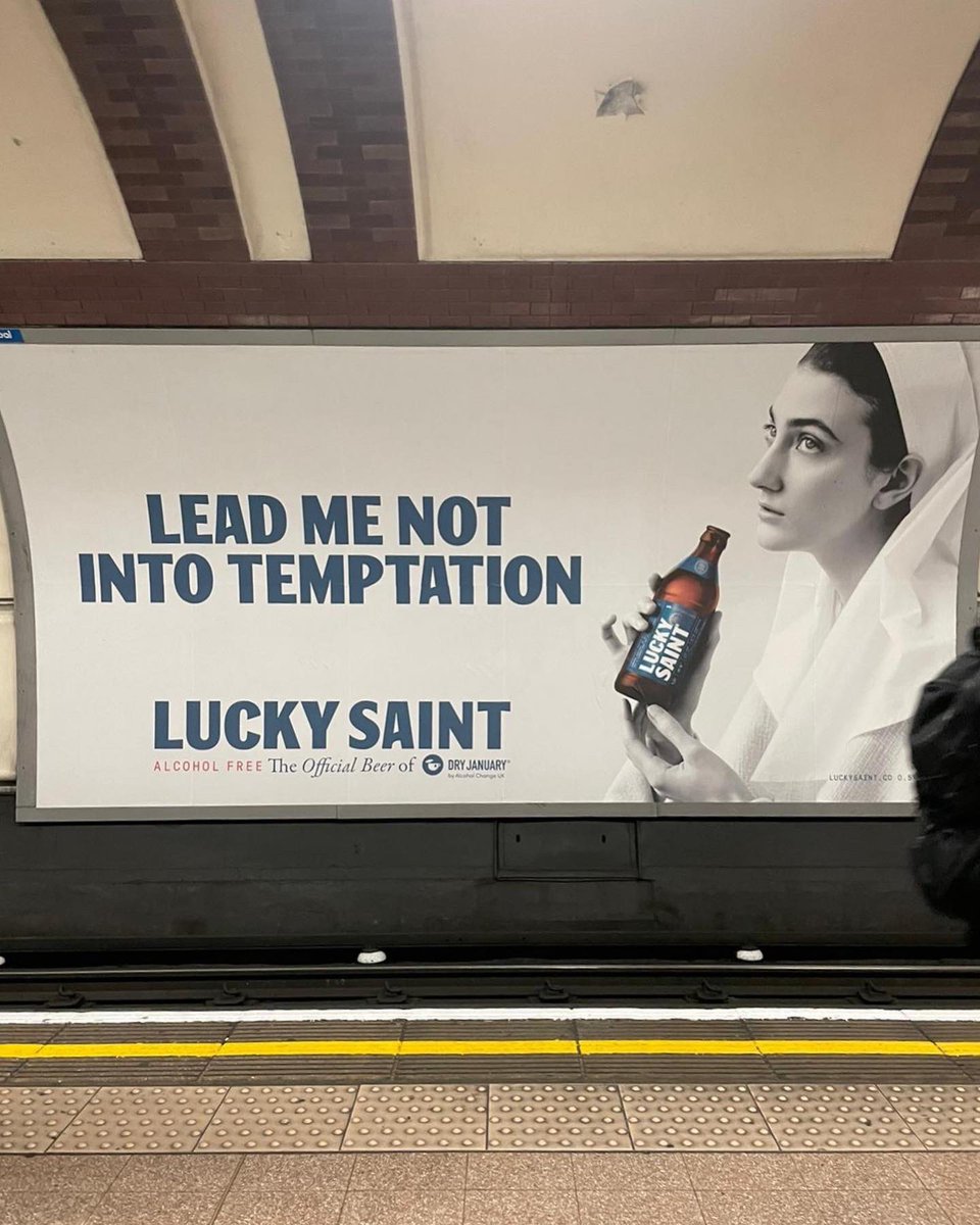 LuckySaintBeer's tweet photo. Have you spotted us on the tube yet? 📸 Find us on digital and print screens nationwide, and be sure to share your pictures with us by tagging @LuckySaintBeer 

Thou shalt not, not drink this Dry January.

#DryJanuary #luckysaint #alcoholfree https://t.co/R06pHWZjtd