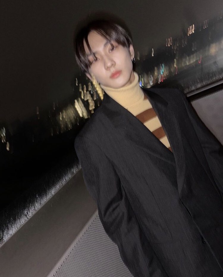 The vastness of the night sky is filled with hanging clouds, stars, and a very magnificent moon. We attended a large Prada event in Italy in formal clothes under a stunning sky.