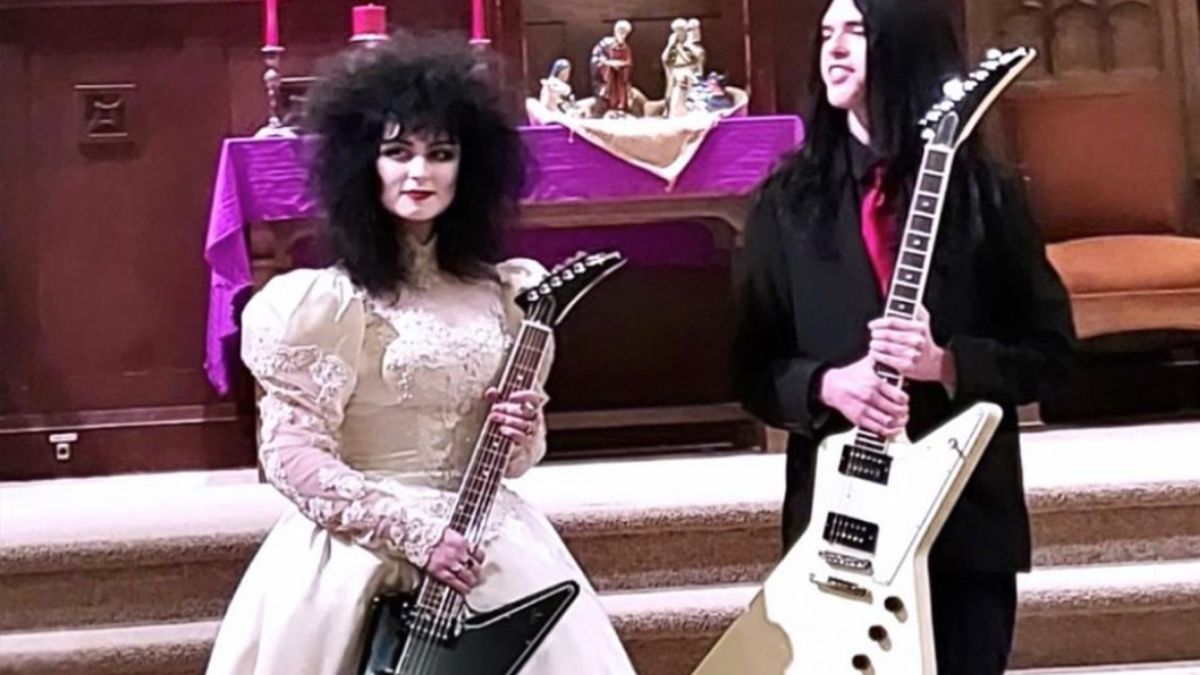 GuitarWorld's tweet photo. Metal-loving couple exchange Gibson Explorers instead of rings at wedding https://t.co/l9Q4MUPggt https://t.co/Wva47zqFqC