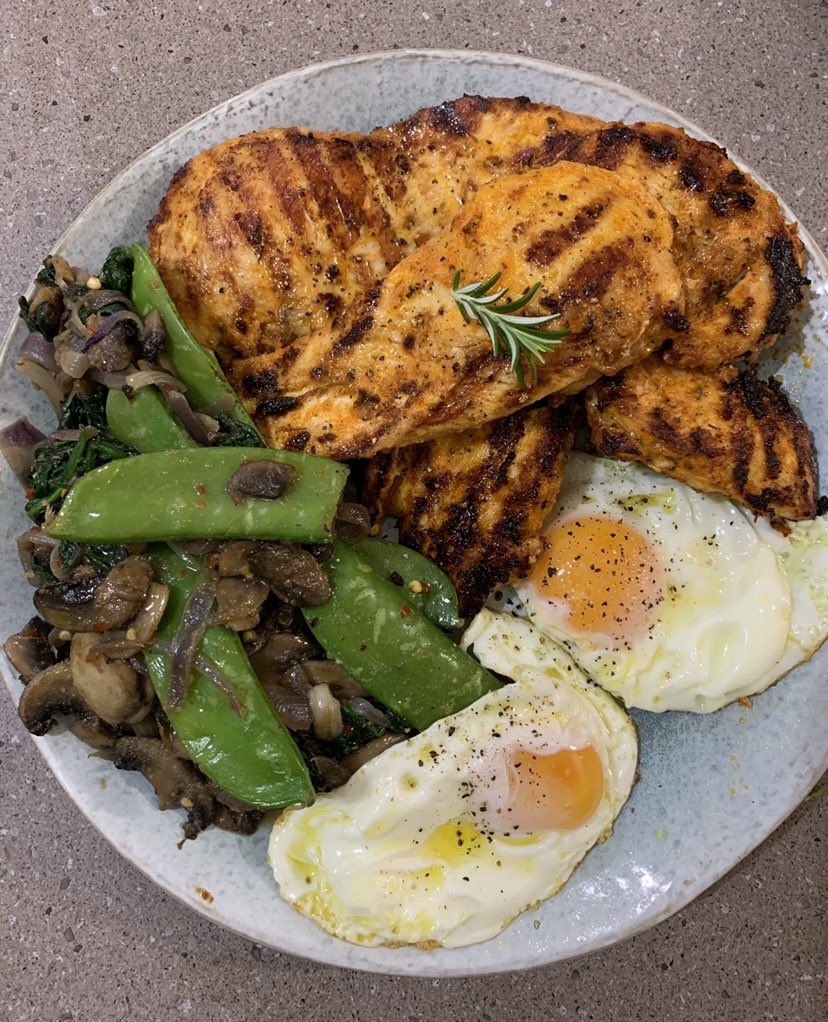 Grilled chicken with sunny side eggs, snow peas and mushrooms. 😋