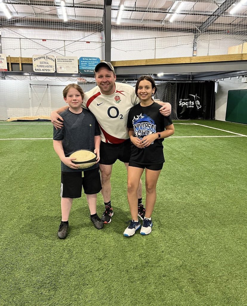 Two of our Grade 7 students learning to play rugby at HB studios with Mr. Strong!