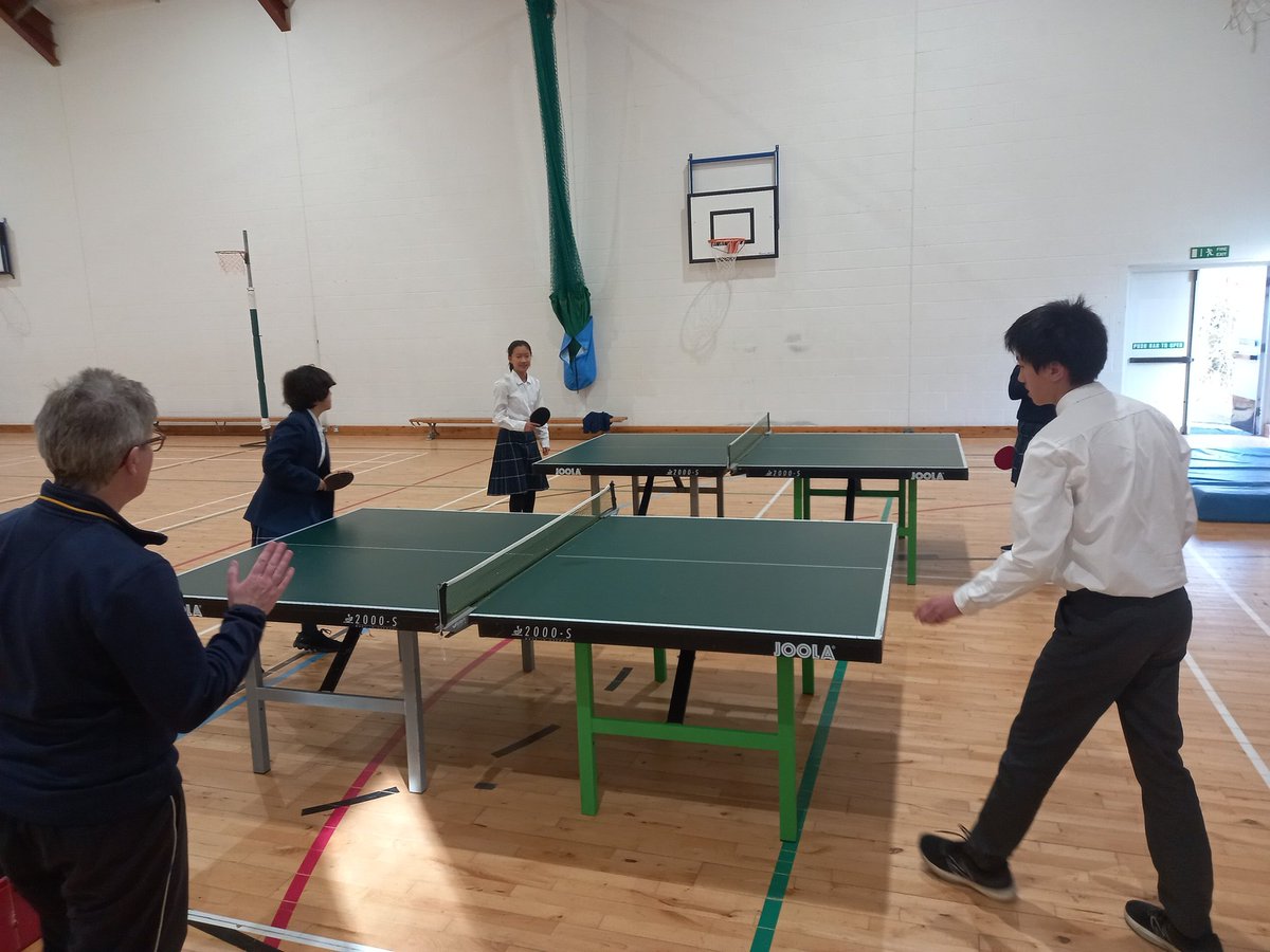 GCSE students leading table tennis club, work that back hand....